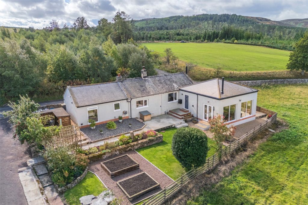 Aerial view of the bungalow and garden in Harbottle